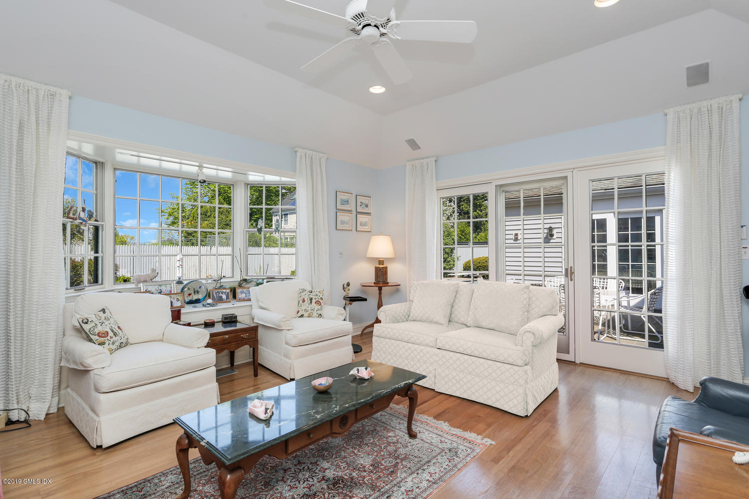 11 Wahneta Road Old Greenwich, CT 06870 - Photo 12 of 26 a living room with furniture and a large window