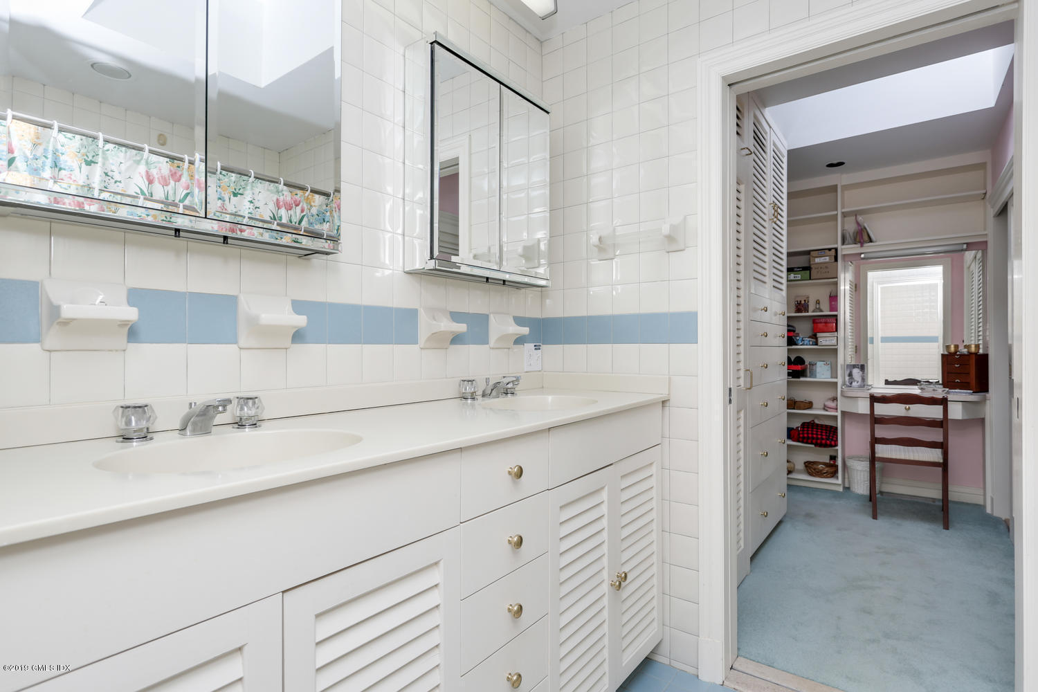 11 Wahneta Road Old Greenwich, CT 06870 - Photo 15 of 26 a bathroom with double vanity and a sink