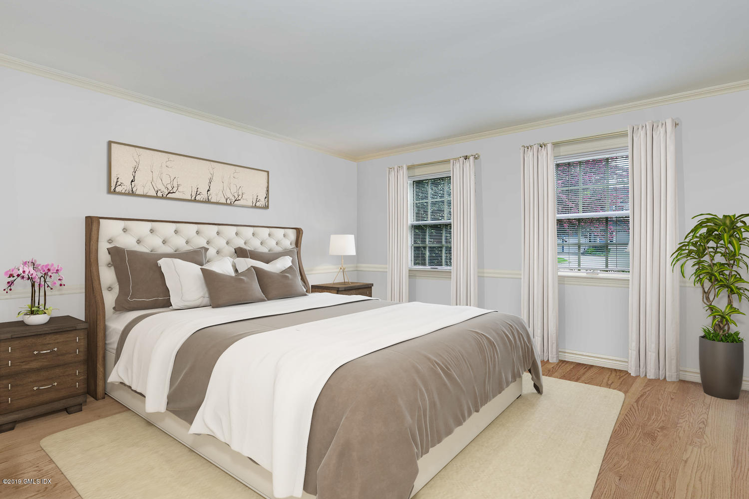 11 Wahneta Road Old Greenwich, CT 06870 - Photo 20 of 26 a bedroom with a large bed and a potted plant