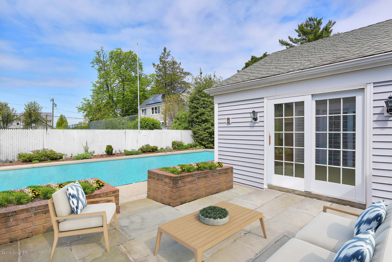 11 Wahneta Road Old Greenwich, CT 06870 - Photo 21 of 26 a backyard of a house with outdoor seating