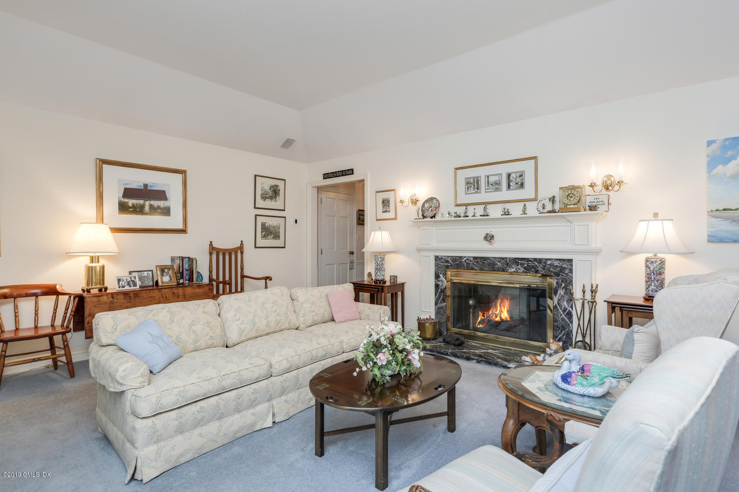 11 Wahneta Road Old Greenwich, CT 06870 - Photo 5 of 26 a living room with furniture and a fireplace