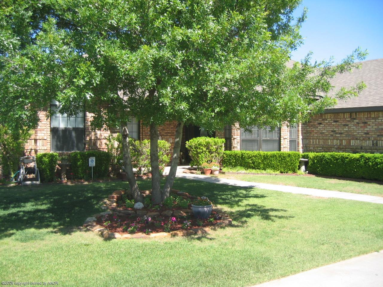 711 McKenzie Road Amarillo, TX 79118 - Photo 1 of 38 a view of a backyard with a garden