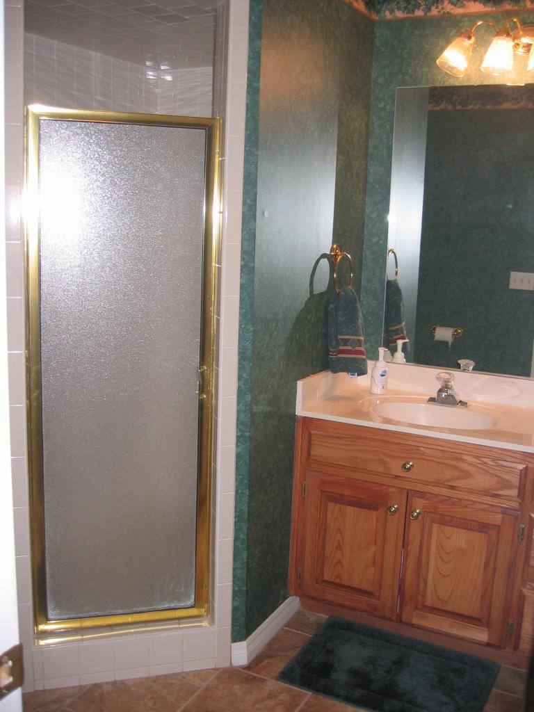 711 McKenzie Road Amarillo, TX 79118 - Photo 23 of 38 a bathroom with a sink and a mirror