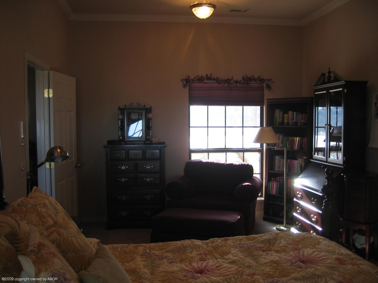 711 McKenzie Road Amarillo, TX 79118 - Photo 8 of 38 a living room with furniture a window and a flat screen tv