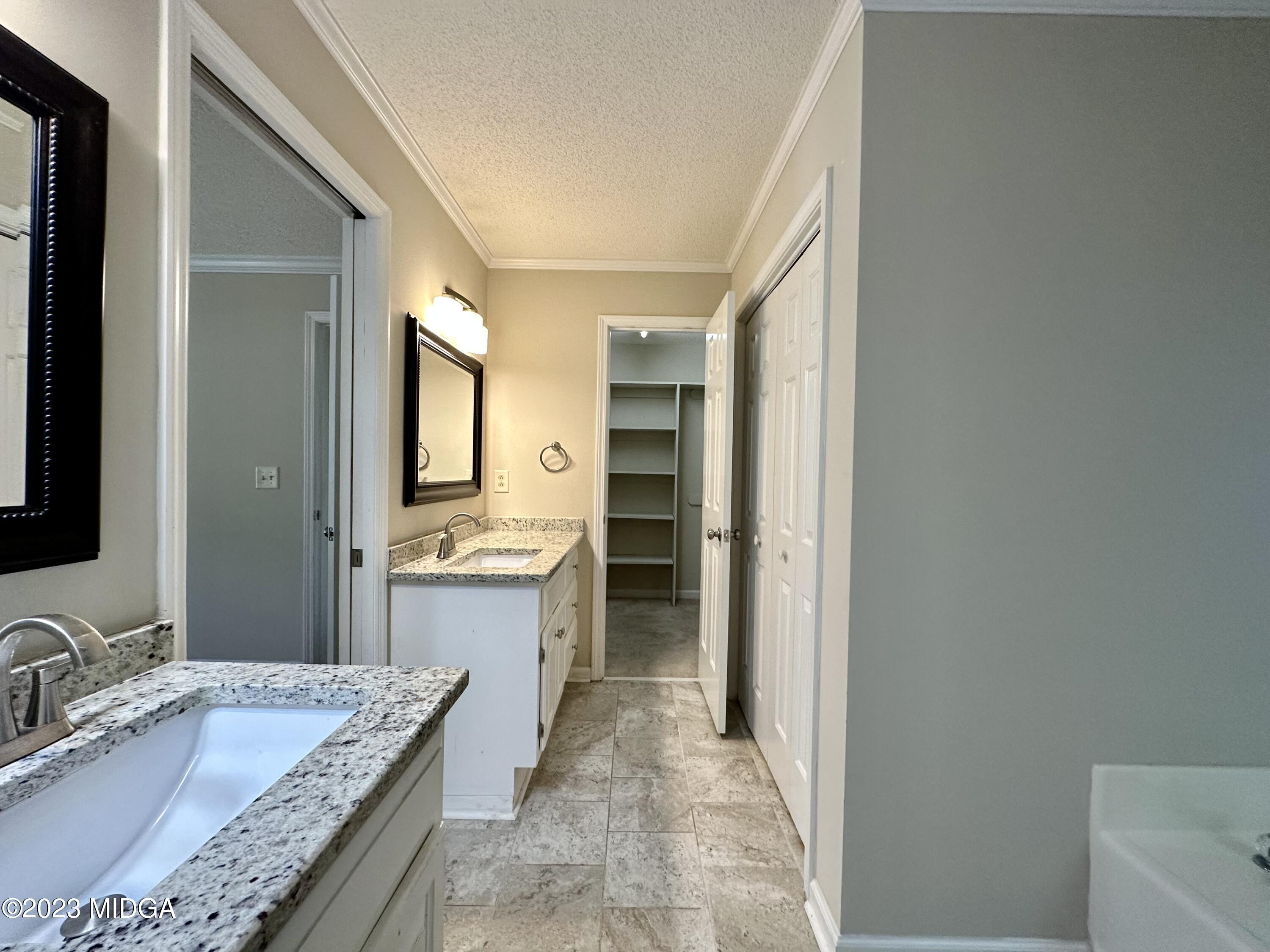 310 Old Oak Road Macon, GA 31216 - Photo 13 of 27 a bathroom with a granite countertop sink and a mirror