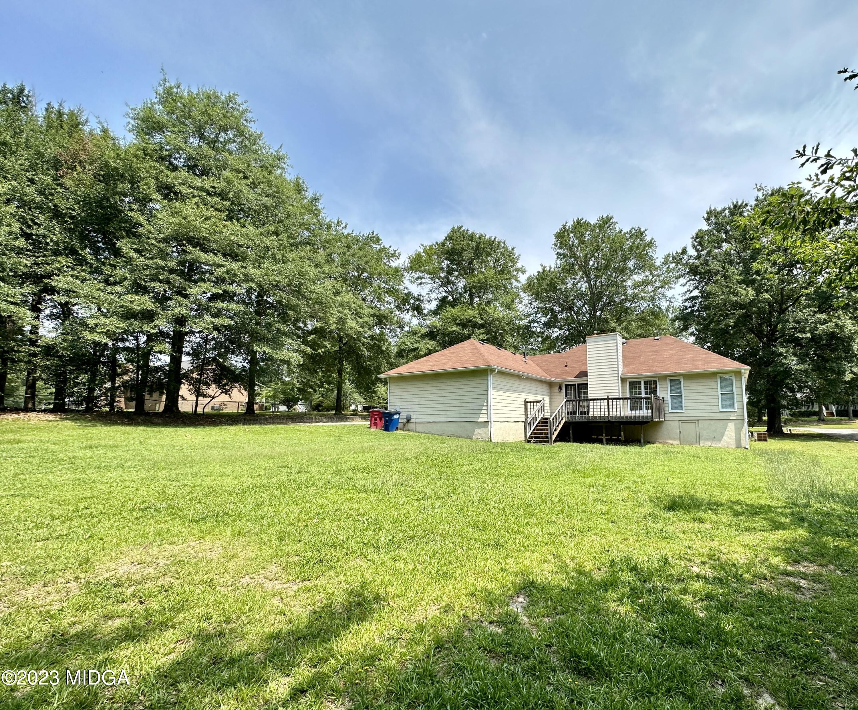 310 Old Oak Road Macon, GA 31216 - Photo 23 of 27 a house with trees in the background