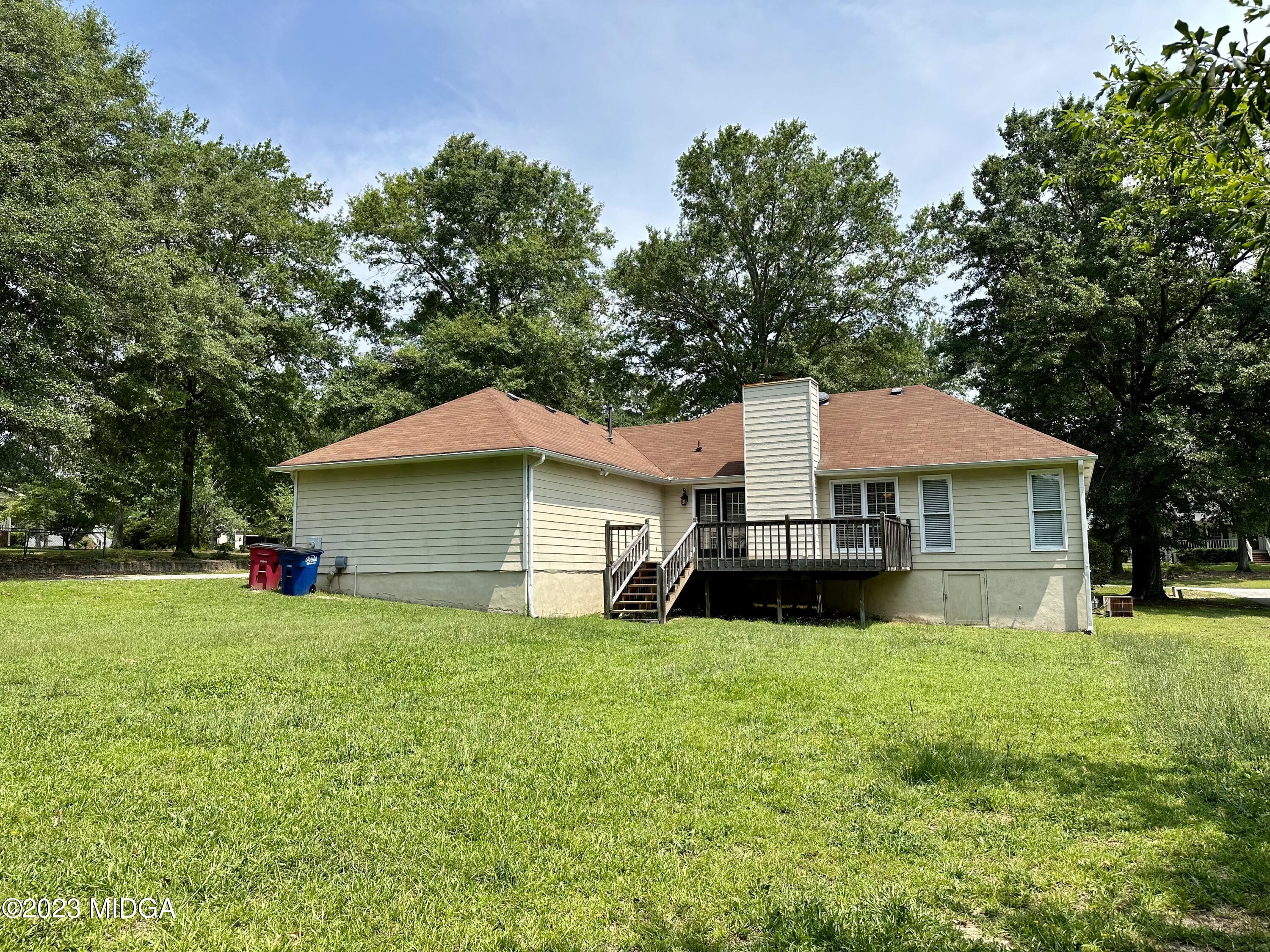 310 Old Oak Road Macon, GA 31216 - Photo 24 of 27 a view of a house with a yard