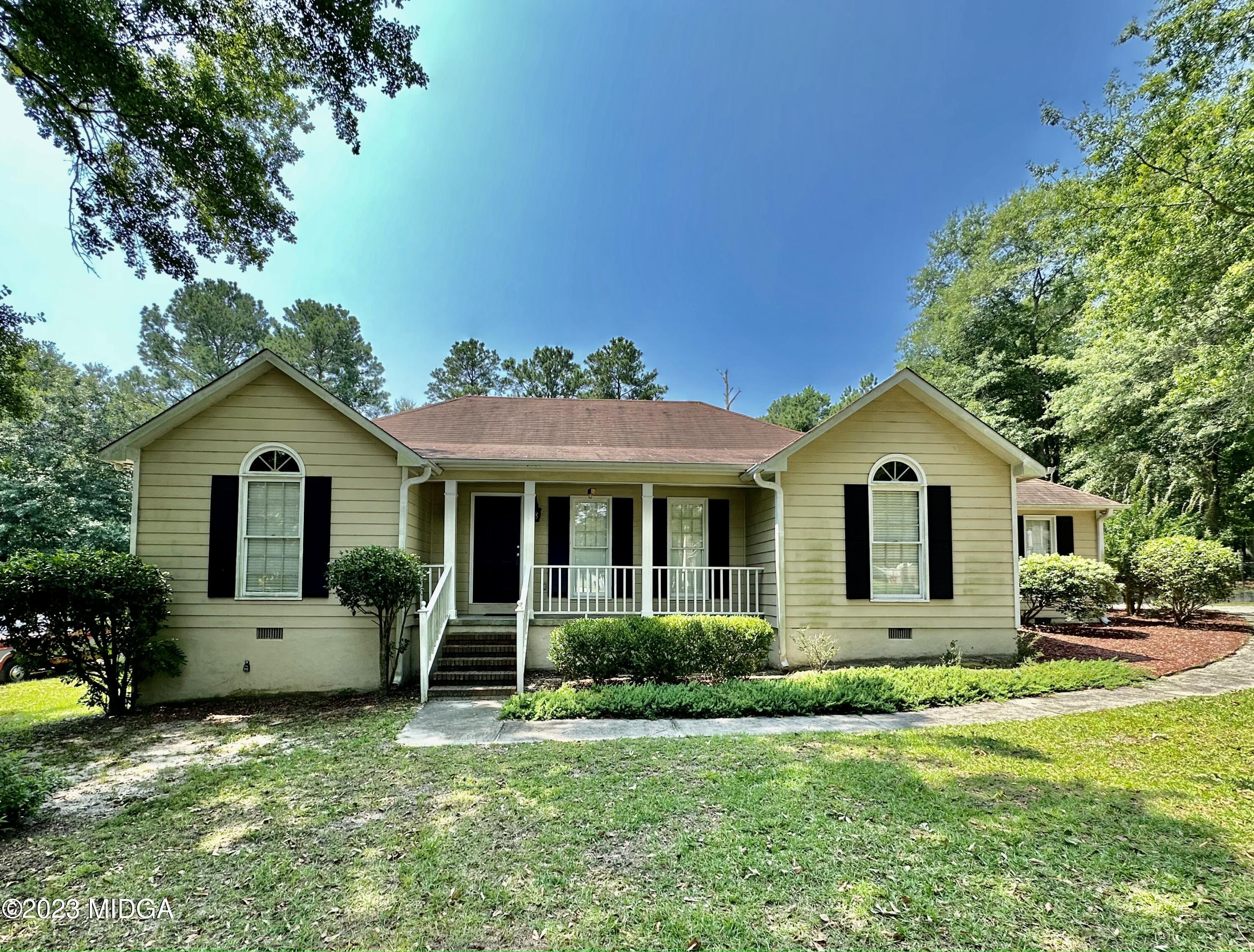 310 Old Oak Road Macon, GA 31216 - Photo 26 of 27 a front view of a house with a yard and trees