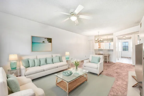 a living room with furniture and a table