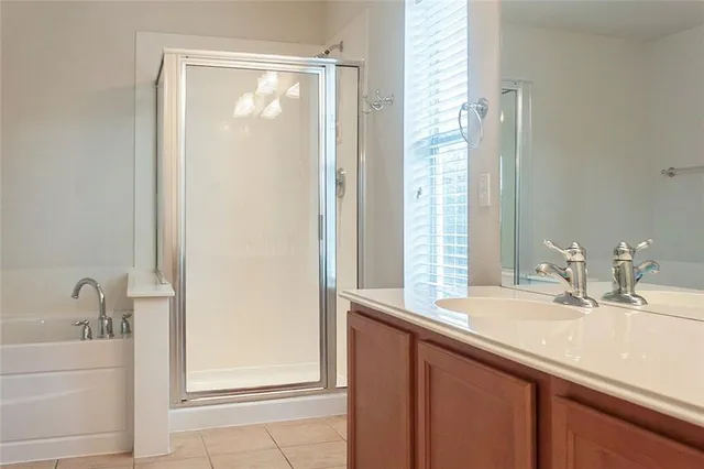 a bathroom with a glass shower door