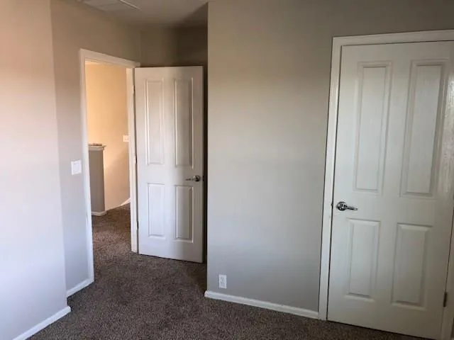 a backyard of house with wooden fence