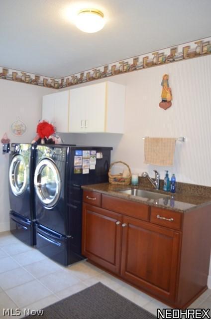 7608 Dewey Road Thompson, OH 44086 - Photo 11 of 25 1st floor laundry/mud room with ceramic flooring, storage and sink with granite counter.