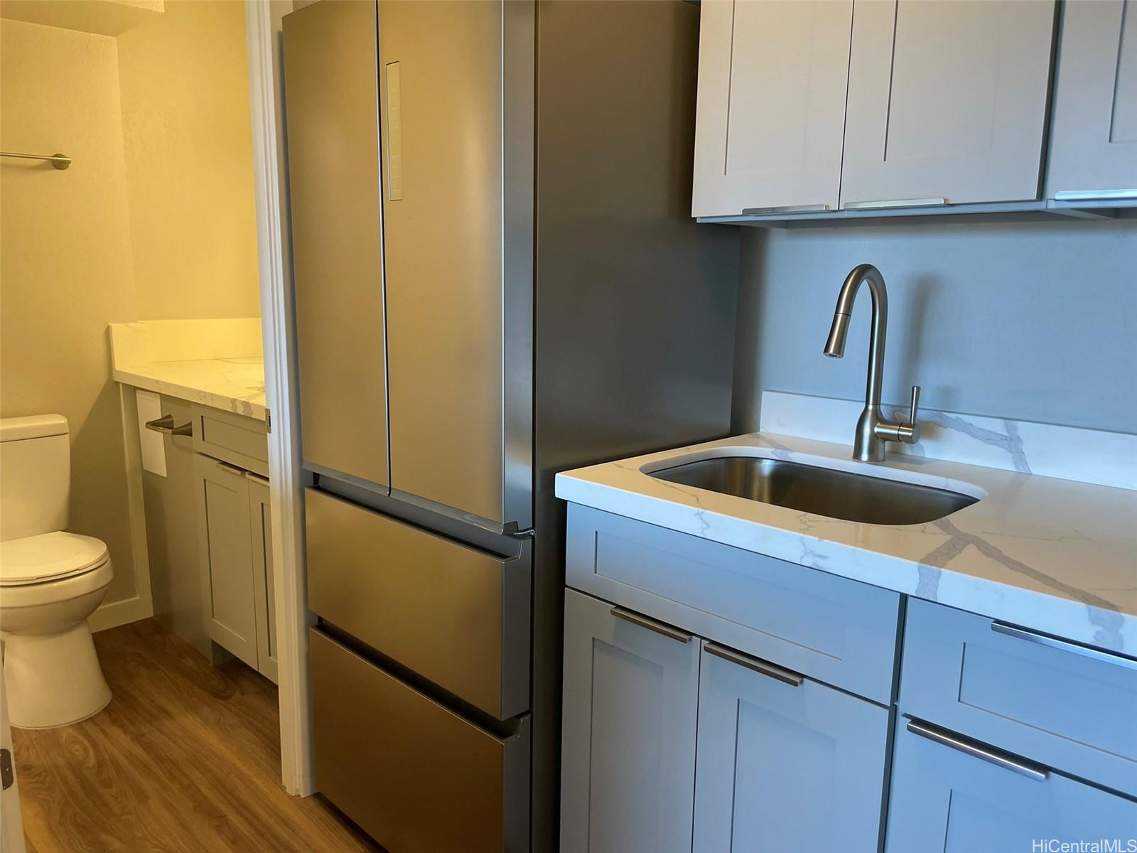 2888 Ala Ilima Street, Unit 910 Honolulu, HI 96818 - Photo 6 of 15 a bathroom with a sink and a toilet
