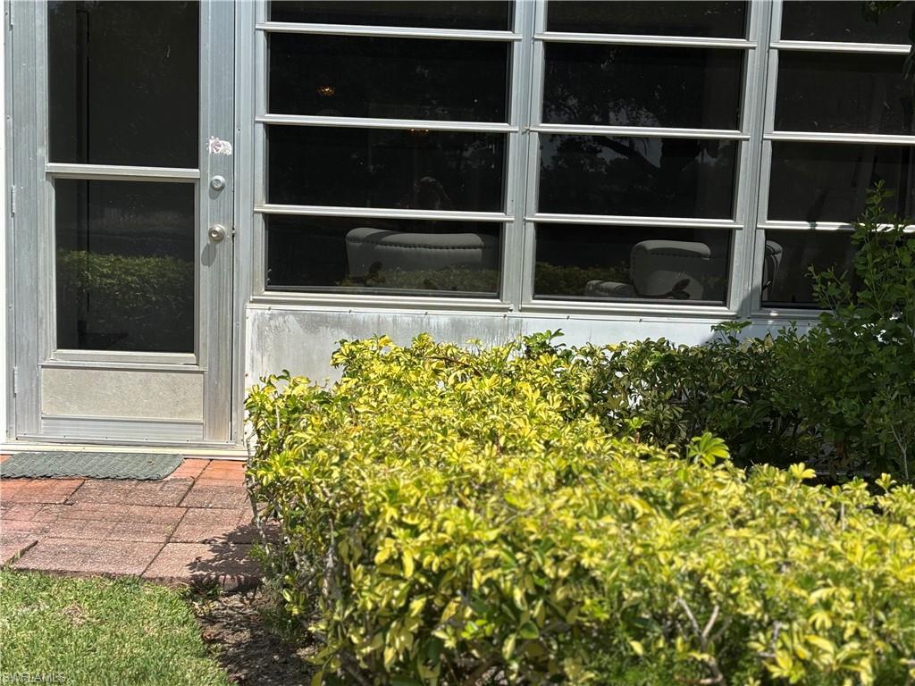 600 Valley Stream Drive, Unit D3 Naples, FL 34113 - Photo 2 of 6 a view of a pathway with a window