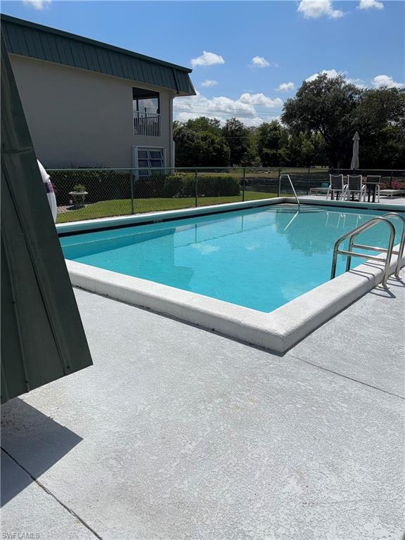 600 Valley Stream Drive, Unit D3 Naples, FL 34113 - Photo 6 of 6 a view of a swimming pool and a yard