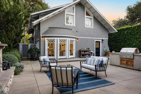a view of a house with sitting area and furniture