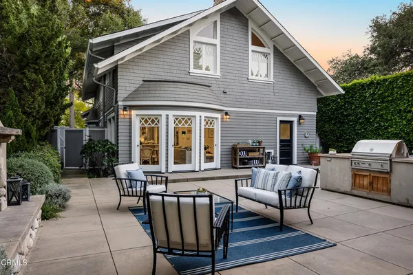 a view of a house with sitting area and furniture