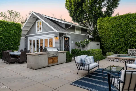 a view of house with patio outdoor seating