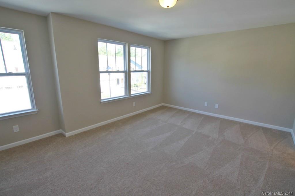 2176 Bluebell Way, Unit 172 Tega Cay, SC 29708 - Photo 14 of 22 an empty room with windows