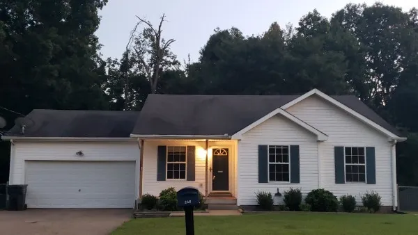 a view of outdoor space yard and front view of a house