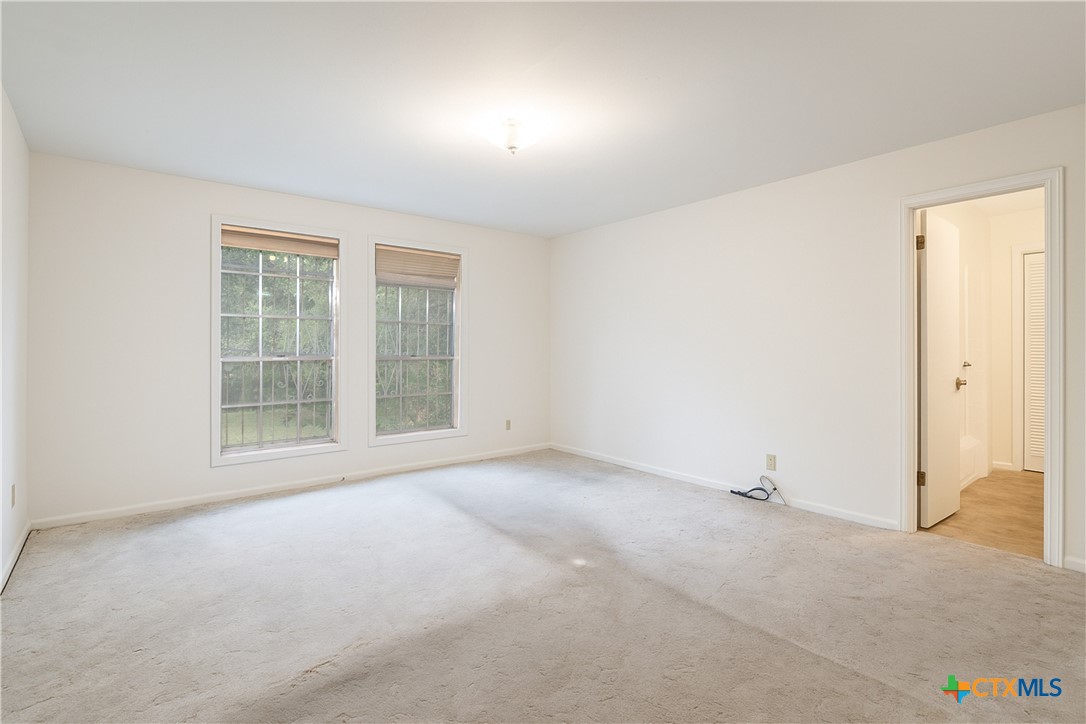 832 East Court Street Seguin, TX 78155 - Photo 17 of 31 an empty room with windows