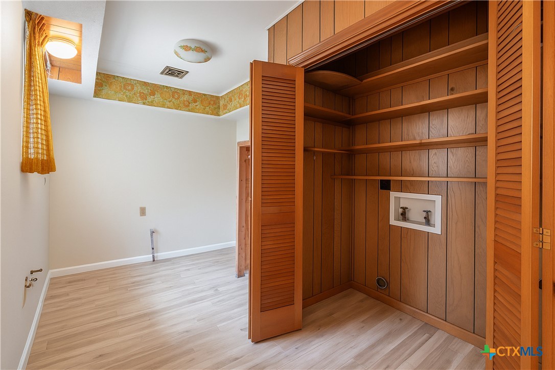 832 East Court Street Seguin, TX 78155 - Photo 19 of 31 a view of an empty room with wooden floor and a window