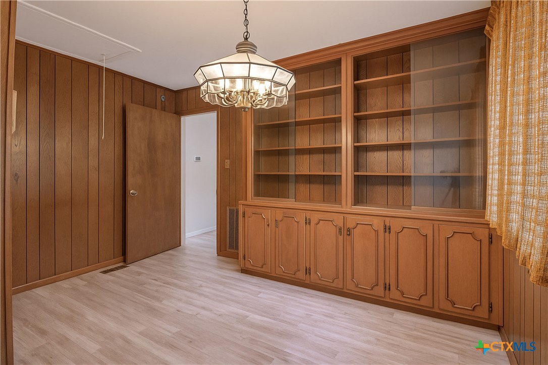 832 East Court Street Seguin, TX 78155 - Photo 20 of 31 a view of a room with wooden floor and windows