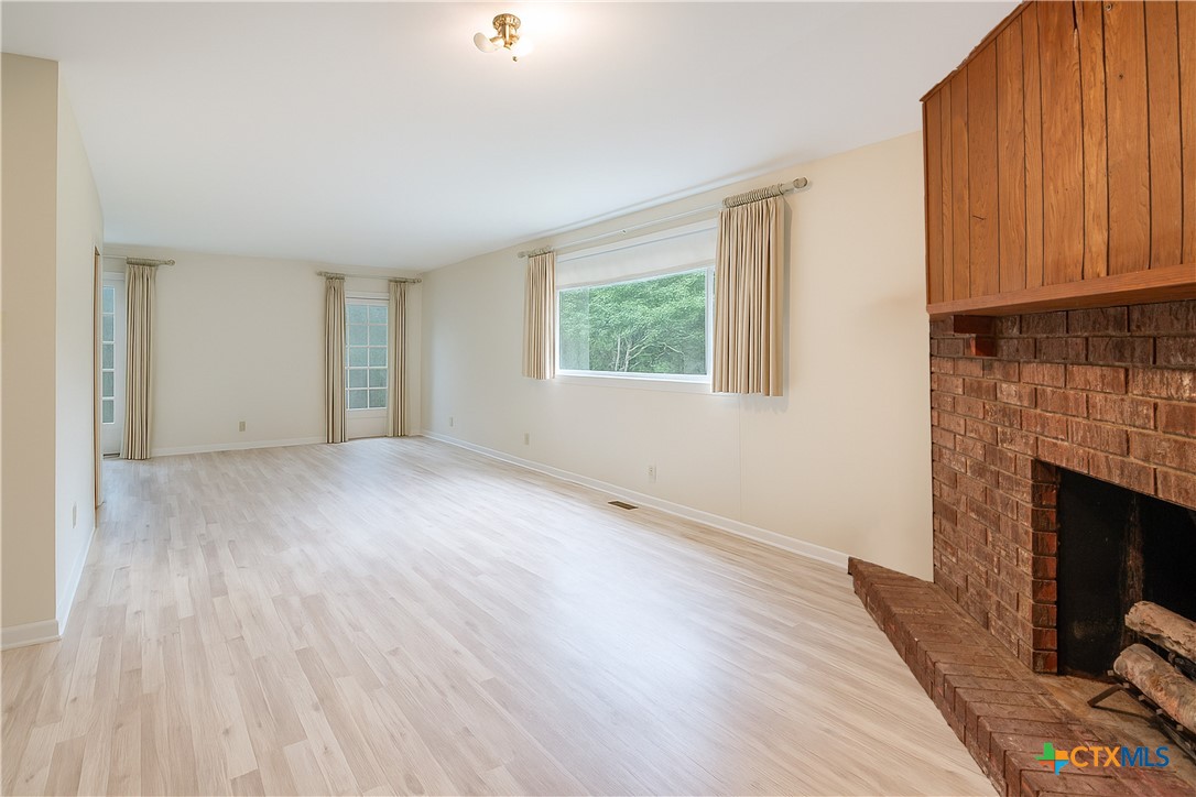 832 East Court Street Seguin, TX 78155 - Photo 21 of 31 a view of empty room with wooden floor and fan