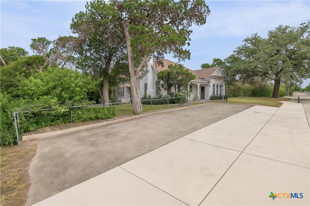 832 East Court Street Seguin, TX 78155 - Photo 24 of 31 a view of a road with a building in the background
