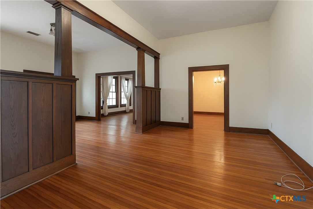 832 East Court Street Seguin, TX 78155 - Photo 8 of 31 a view of a hallway view with wooden floor and staircase