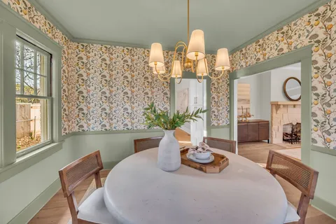 a dining room with furniture and window