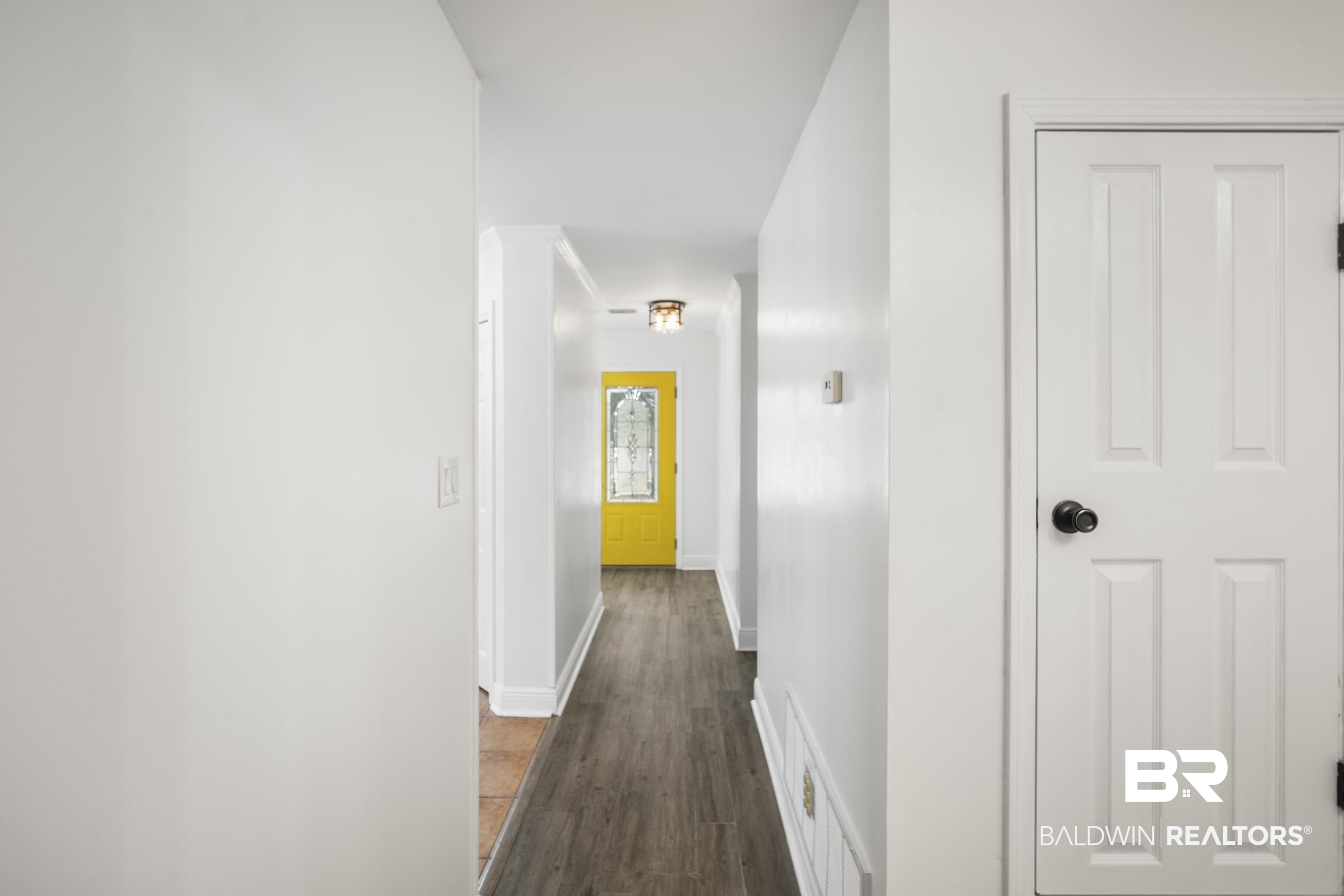 3101 Autumn Ridge Drive West Mobile, AL 36695 - Photo 12 of 36 Corridor featuring dark wood finished floors and baseboards