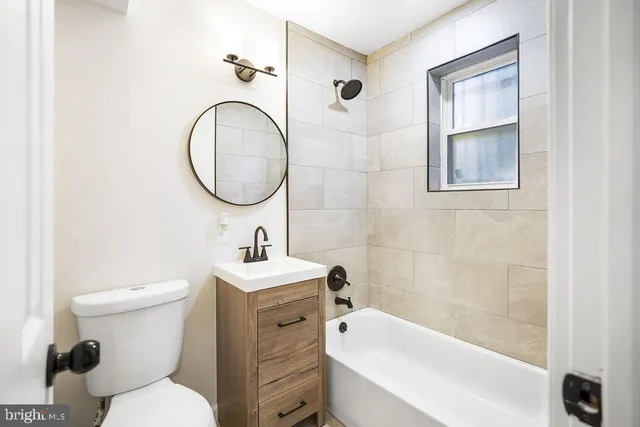 a bathroom with a toilet a sink and a bathtub