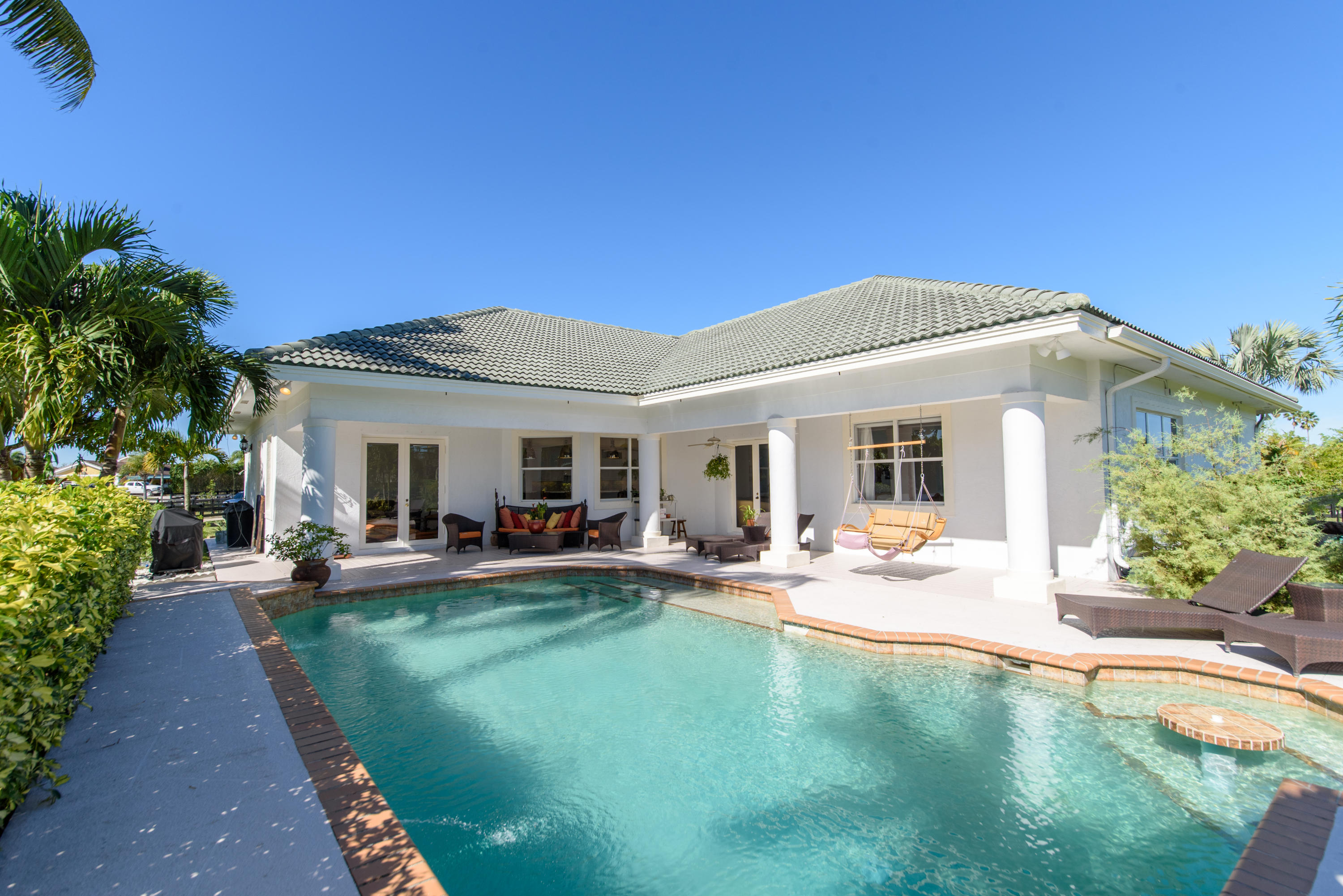13200 Southfields Road Wellington, FL 33414 - Photo 6 of 39 Sunny pool patio