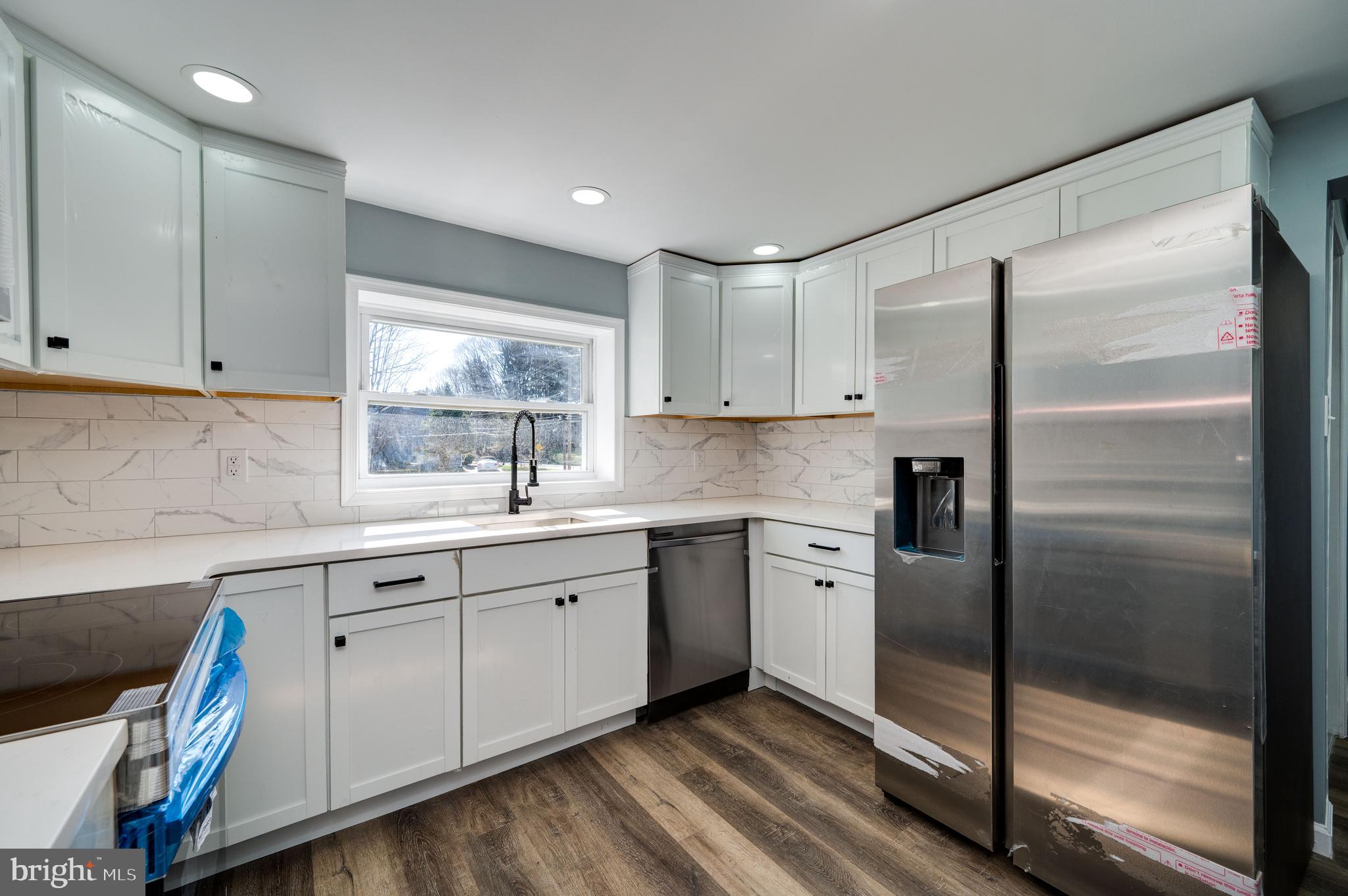 3247 State Hill Road Reading, PA 19608 - Photo 20 of 40 a kitchen with white cabinets and white appliances