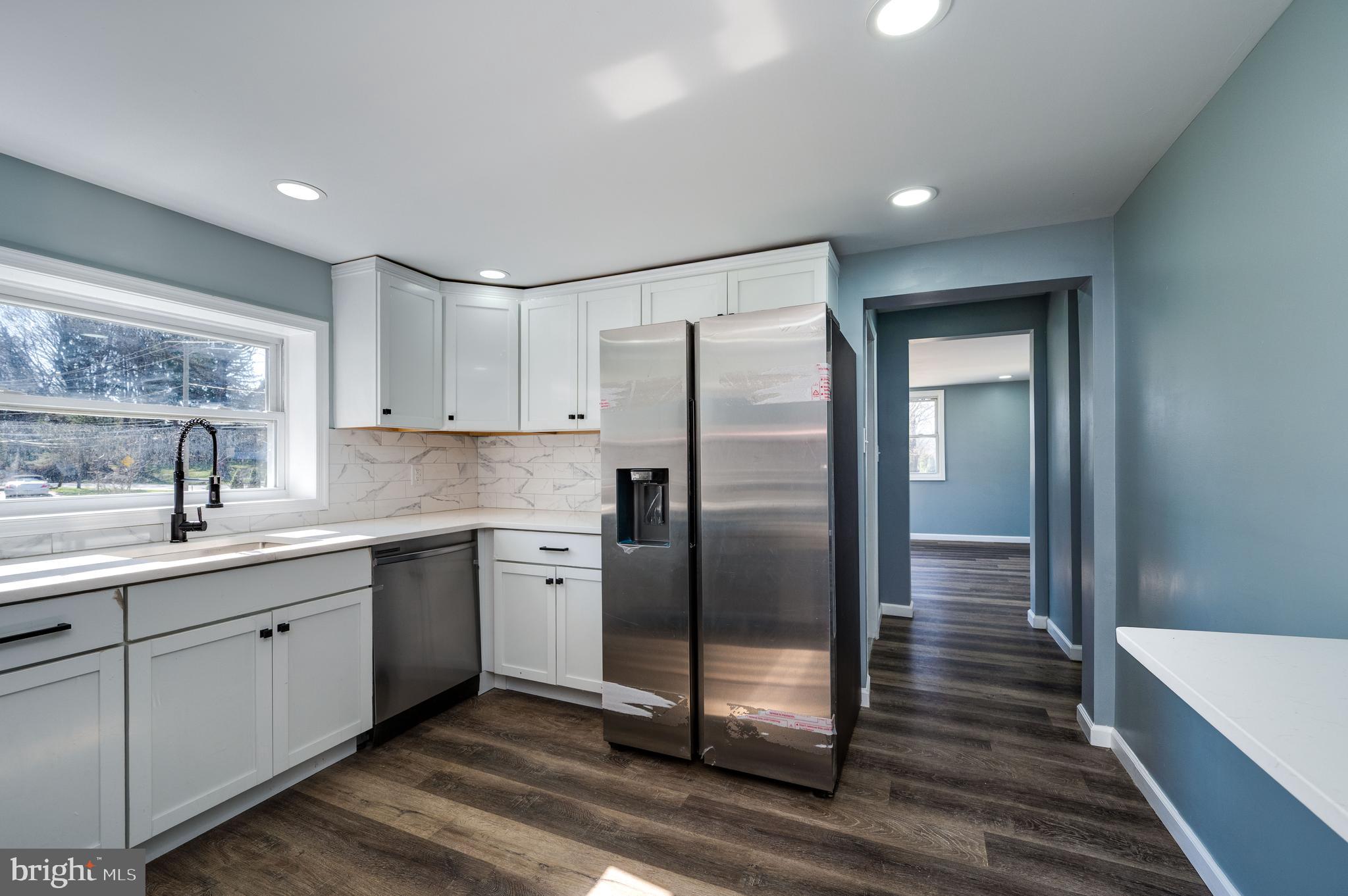 3247 State Hill Road Reading, PA 19608 - Photo 21 of 40 a kitchen with stainless steel appliances granite countertop a refrigerator sink and cabinets