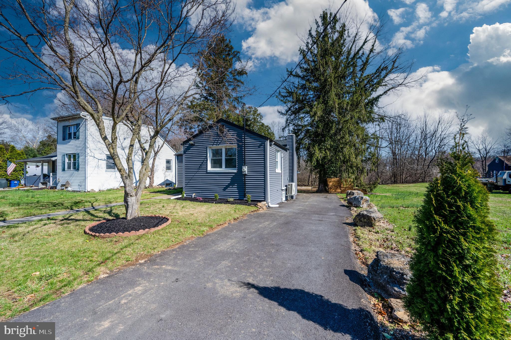 3247 State Hill Road Reading, PA 19608 - Photo 39 of 40 a front view of a house with a garden