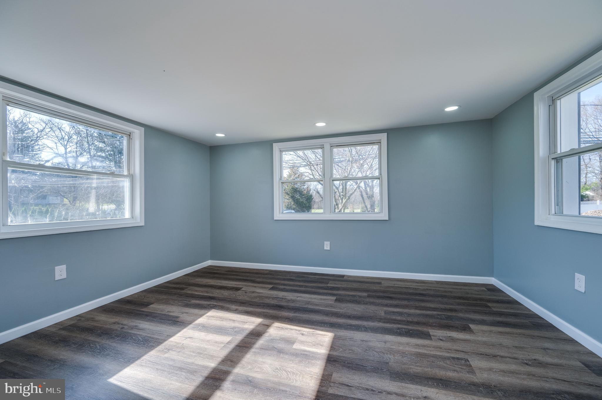 3247 State Hill Road Reading, PA 19608 - Photo 4 of 40 a view of empty room with wooden floor and fan