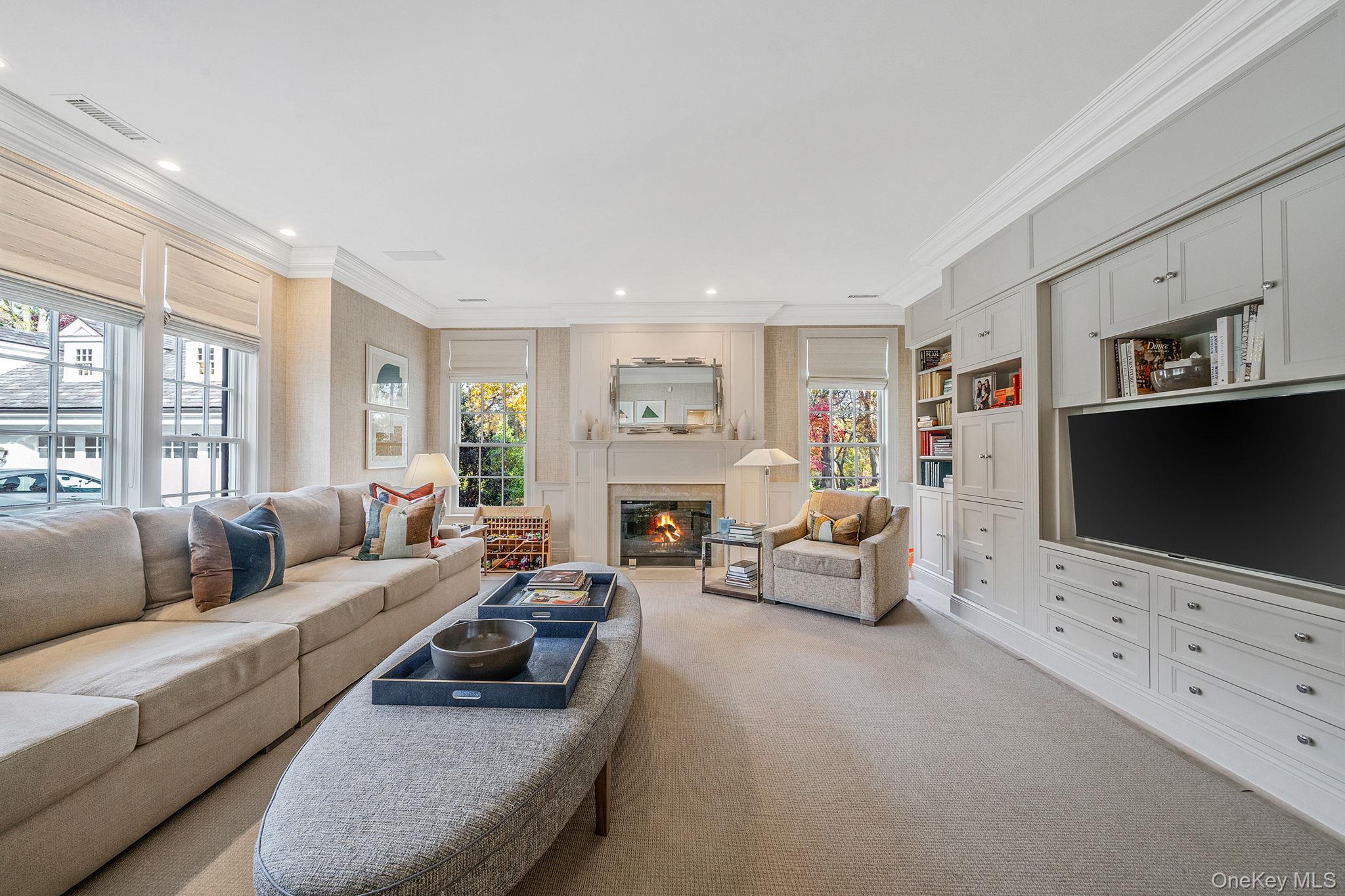 530 Chicken Valley Road Locust Valley, NY 11560 - Photo 19 of 50 Family Room with a glass covered fireplace