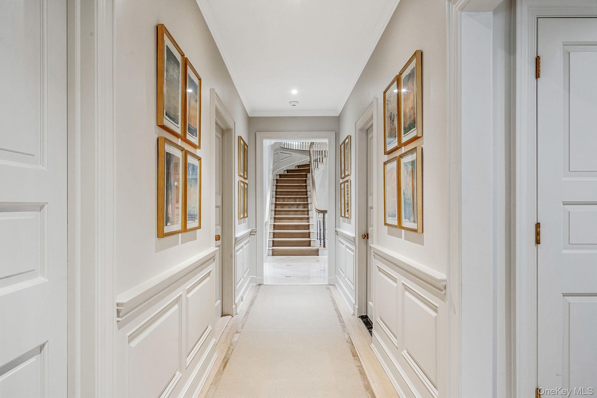 530 Chicken Valley Road Locust Valley, NY 11560 - Photo 20 of 50 Hall with a decorative wall, stairway