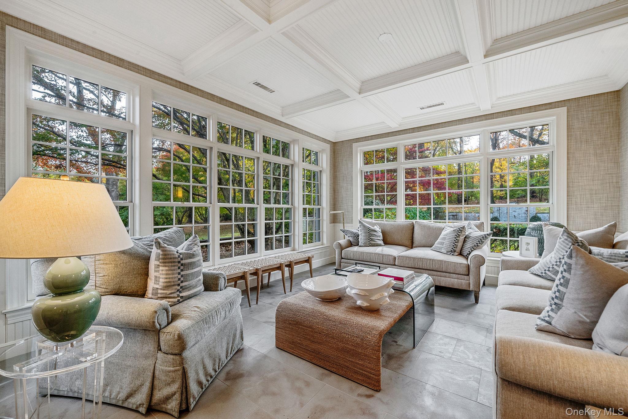 530 Chicken Valley Road Locust Valley, NY 11560 - Photo 25 of 50 Sunroom / solarium featuring coffered ceiling, crown molding, and beam ceiling