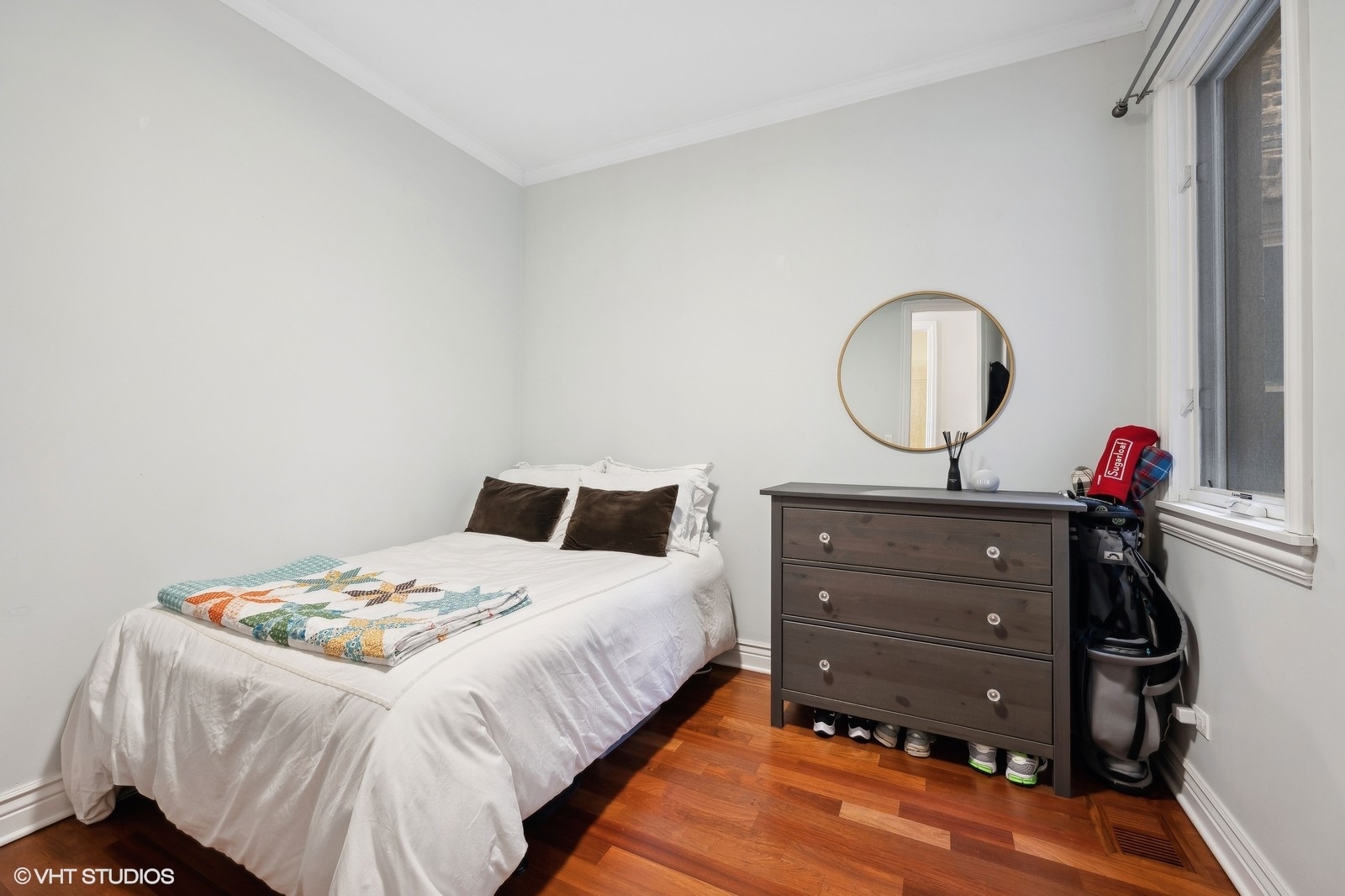 1430 West Irving Park Road, Unit 2 Chicago, IL 60613 - Photo 12 of 23 a bed room with a bed window and a mirror