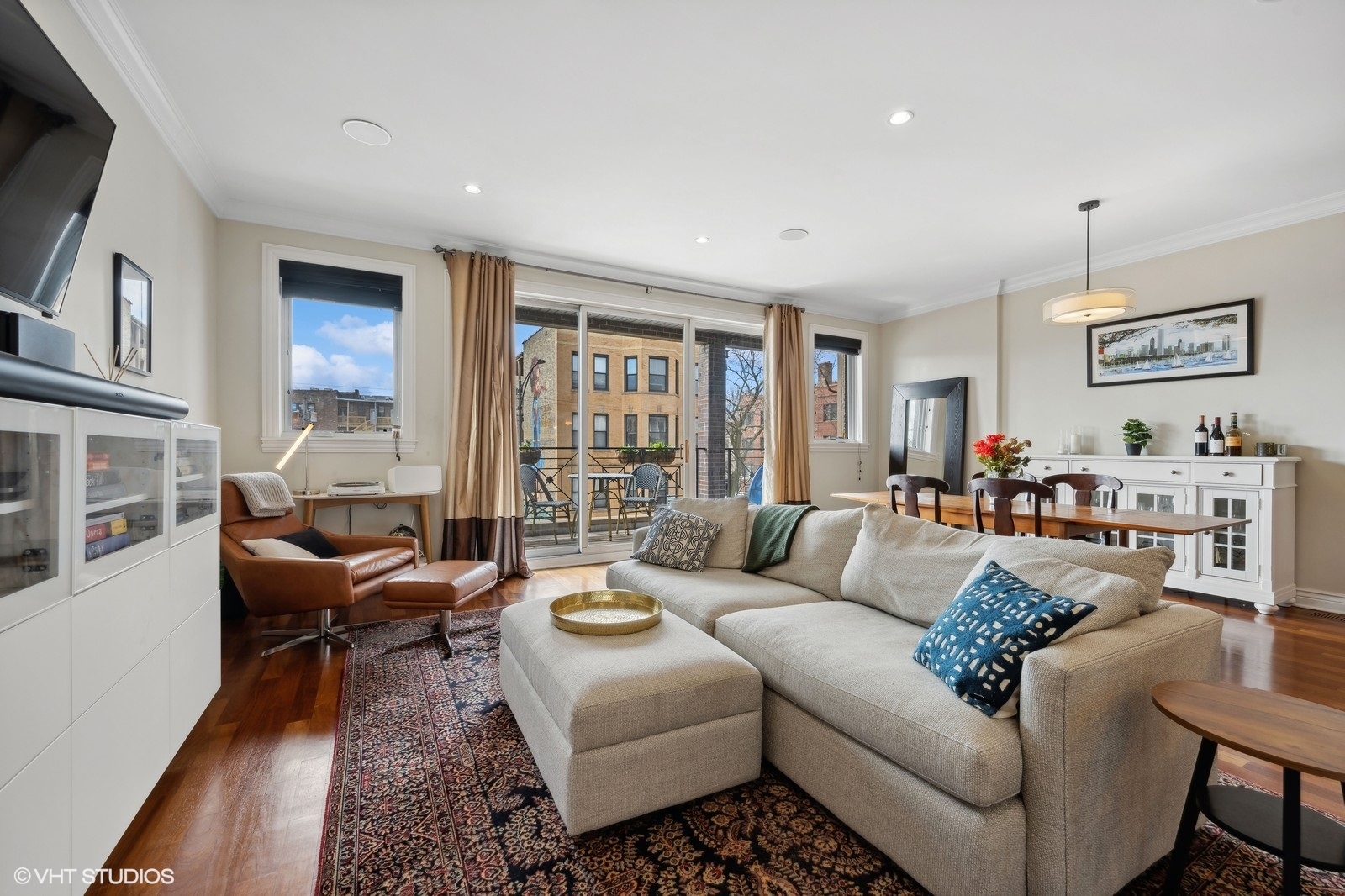 1430 West Irving Park Road, Unit 2 Chicago, IL 60613 - Photo 2 of 23 a living room with furniture and a flat screen tv