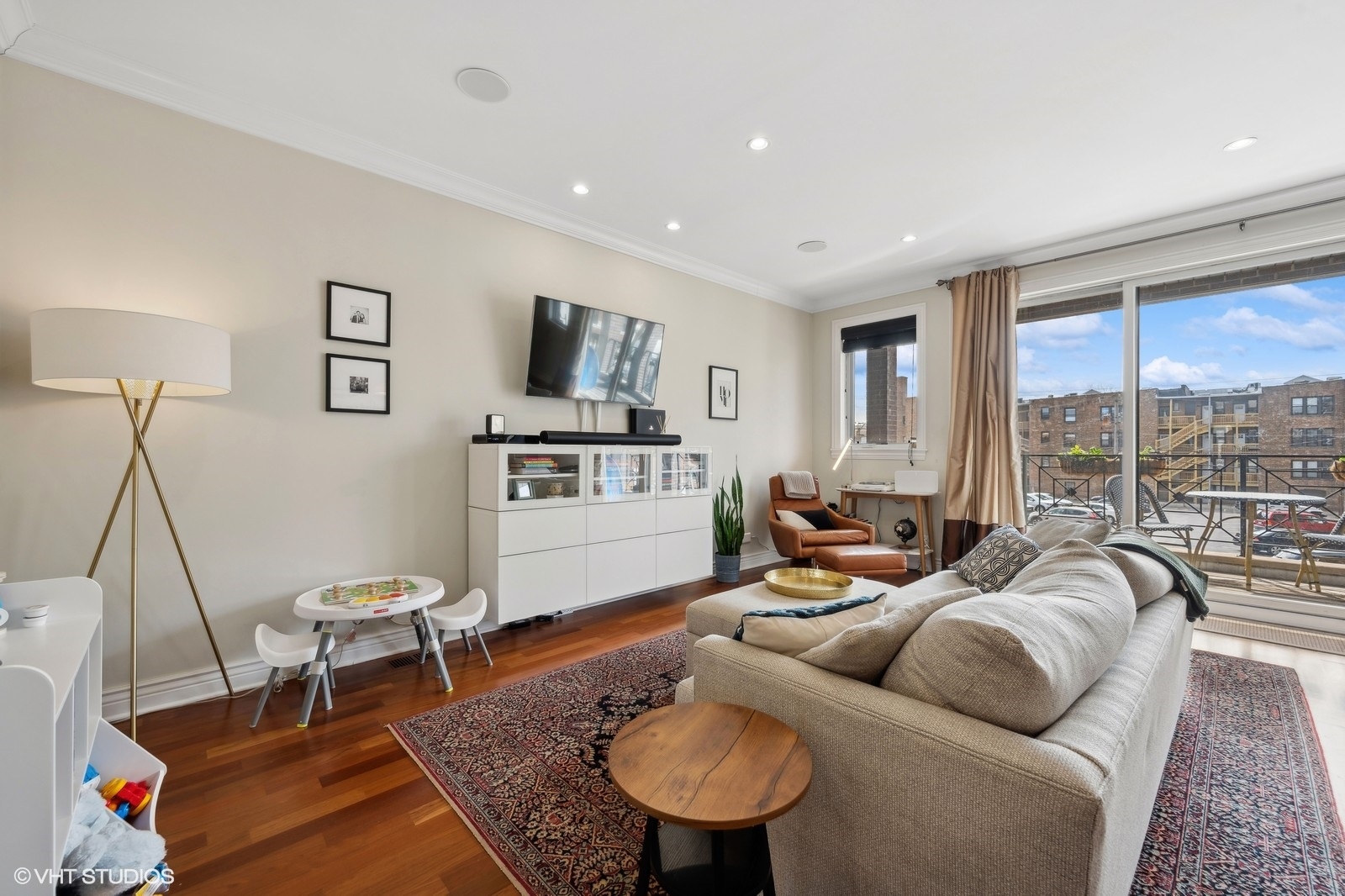 1430 West Irving Park Road, Unit 2 Chicago, IL 60613 - Photo 3 of 23 a living room with furniture and a flat screen tv