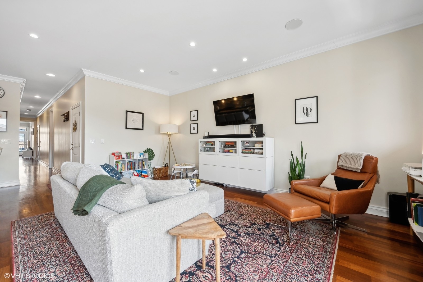 1430 West Irving Park Road, Unit 2 Chicago, IL 60613 - Photo 4 of 23 a living room with furniture and a flat screen tv
