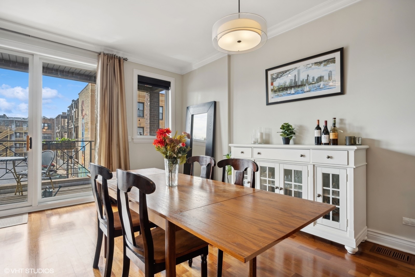 1430 West Irving Park Road, Unit 2 Chicago, IL 60613 - Photo 8 of 23 a view of a dining room with furniture window and wooden floor