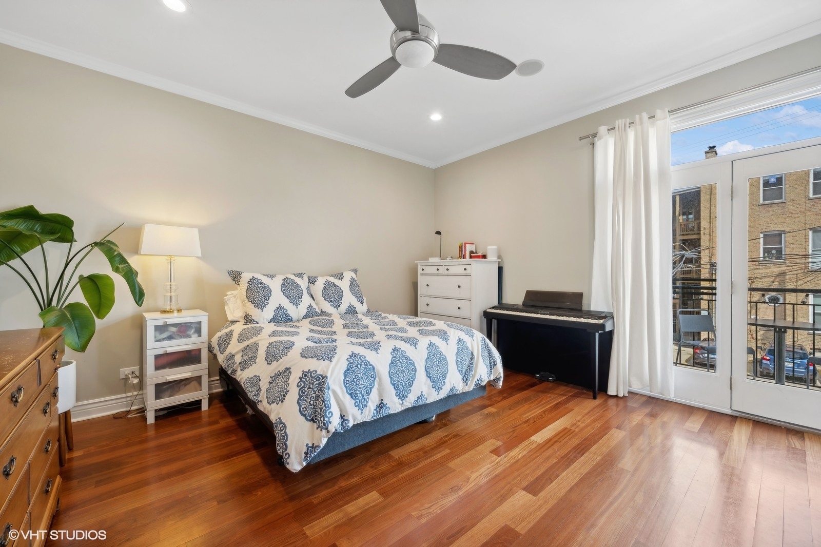 1430 West Irving Park Road, Unit 2 Chicago, IL 60613 - Photo 9 of 23 a bedroom with a bed and a cabinets