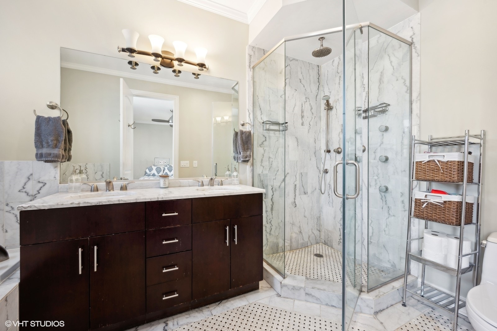 1430 West Irving Park Road, Unit 2 Chicago, IL 60613 - Photo 10 of 23 a bathroom with a double vanity sink mirror and shower