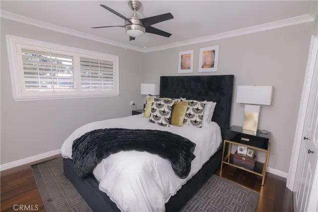 a bedroom with a bed and a lamp