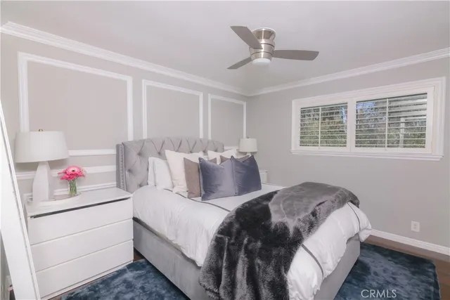 a bedroom with bed and window